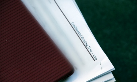 Papers sticking out of Greens leader Christine Milne's bag as she talks to the media this morning outside the senate doors.