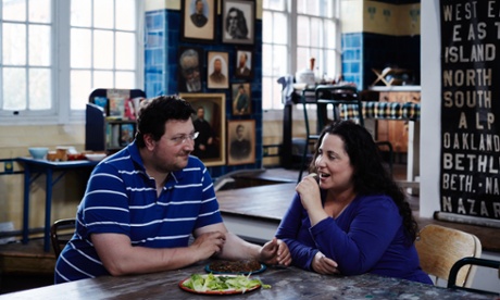 Itamar Srulovich and his wife, Sarit Packer, eating at their table