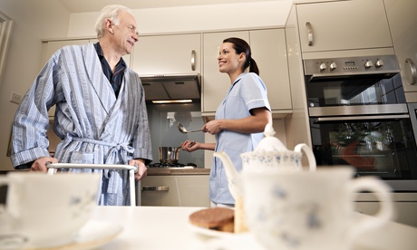 nurse and older man in kitchen