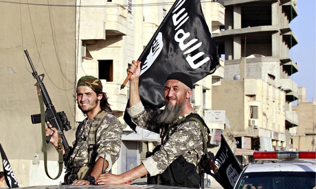 Islamic State fighters parade through Raqqa in Syria. One militant holds a US M16 assault rifle