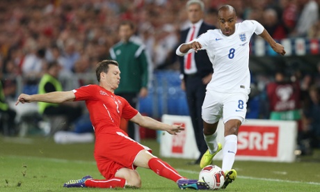 Fabian Delph has had a lively start and bursts past Stephan Lichtsteiner.