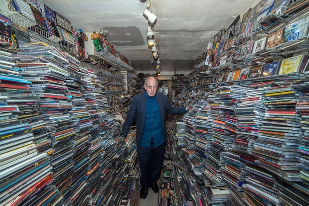 'Birdman' is surrounded by stacks of CDs in his shop in New York City.