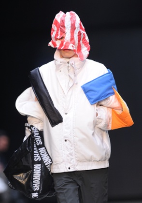 A model in a patched jacket at Christopher Shannon