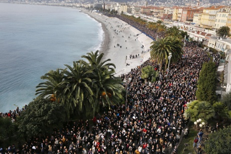 Thousands of people march during a rally along the sea front in Nice.