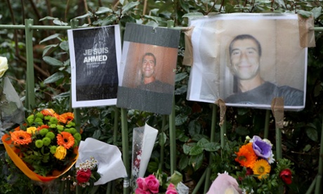 Flowers and banners on the ground where police officer Ahmed Merabet was killed by the two gunmen.