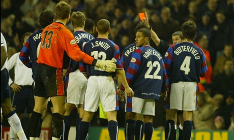 SPURS V CRYSTAL PALACE, 3RD ROUND F.A. CUP MATCH, WHITE HART LANE, TOTTENHAM. 3/1/04. PIC: TOM JENKINS.REFEREE ANDY D'URSO WRONGLY SENDS OFF DANNY BUTTERFIELD AFTER A TACKLE BY JAMIE SMITH.