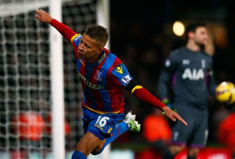 Despair for Spurs keeper Hugo Lloris of Spurs as Dwight Gayle celebrates equalising from the penalty spot .