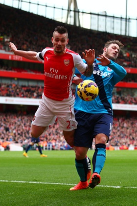 Mathieu Debuchy of Arsenal is challenged by Marko Arnautovic.