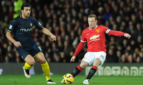 Wayne Rooney plays the ball forward into the box.