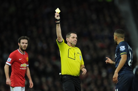 Referee Phil Dowd shows Ryan Bertrand a yellow card for a fould on Antonio Valencia.