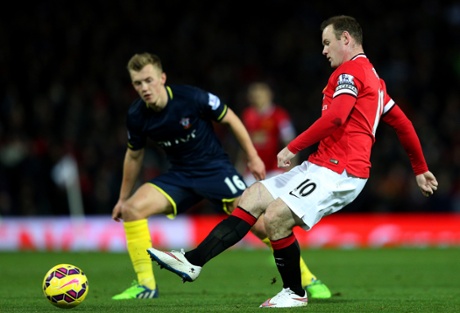 Wayne Rooney sends one into the box.