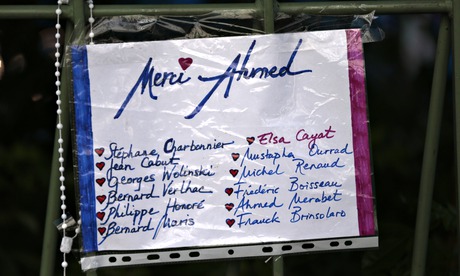 A sign reading 'Thank you Ahmed' referring to the police officer Ahmed Merabet who was killed in the