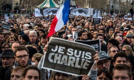 Demonstrators make their way along Place de la Republique.