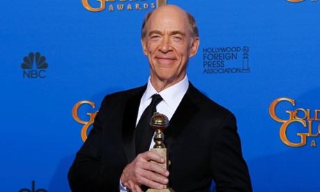 JK Simmons poses with his Golden Globe.