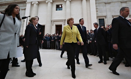 Angela Merkel in a yellow jacket and black trousers at British Museum