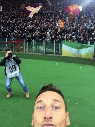 Roma's Francesco Totti just squeezes into the frame of his selfie after scoring against Lazio
