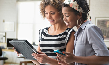 Women using a tablet and smartphone