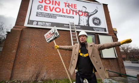 Bez from Happy Mondays unveiling his first election campaign poster on the side of a newsagent's shop in Salford, Greater Manchester.