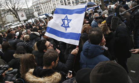 A man waves an Israeli flag during Benjamin Netanyahu's visit to Paris on 12 January 2015. 