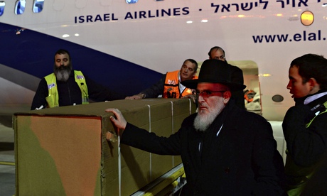 Coffin at Ben Gurion Airport with El-Al plane in background