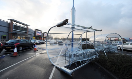 Strong winds overturn a trolley parking unit at Silverlink retail park, North Shields. Met Office gale warnings are in place for most of the UK.
