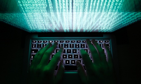 Man typing on computer keyboard