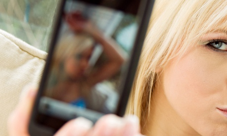Girl taking picture with mobile phone