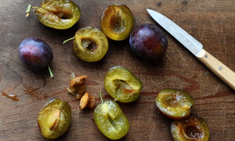 plums on a chopping board