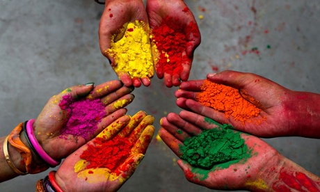 Hands holding coloured dye