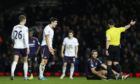 Gareth Barry disagrees with referee Neil Swarbrick's decision.