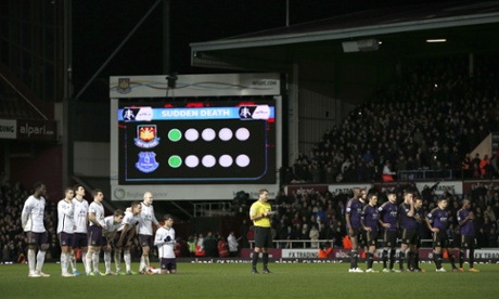 Some nervous looking players line up on the half-way line.
