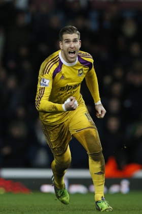 Adrian wheels away in celebration.