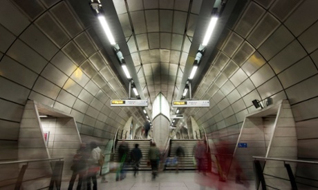 Long Exposure shot of people moving through Southwark Underground station.