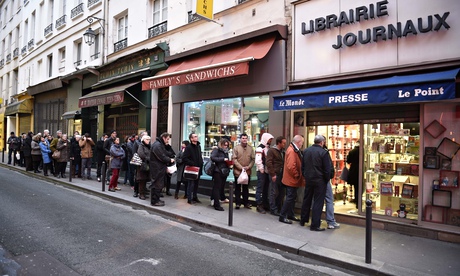 Queue outside newsagent in Paris