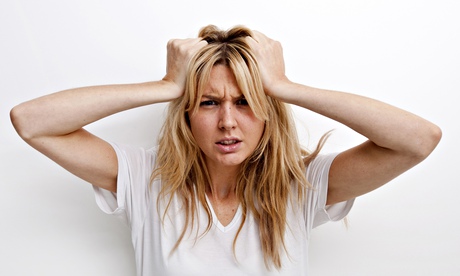 Portrait of frustrated woman pulling against white background