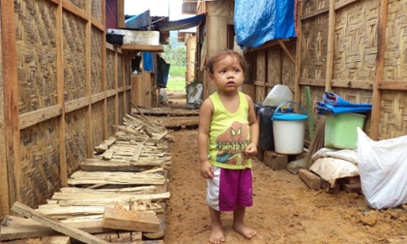 Girl standing in the street after a natural disaster in the Philippines.