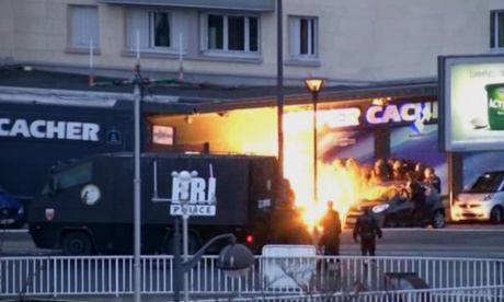 Police officers storming a kosher grocery to end a hostage situation in Paris last week