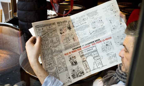 A man reads the latest copy of Charlie Hebdo after it went on sale in France on Wednesday morning.