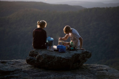 A couple cooking a camping dinner, Ozark Highlands Trail. Arkansas