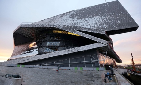Labourers work at the new Philharmonie de Paris ahead of its opening on 14 January.