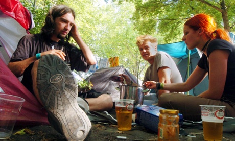 Festival goers take a time out at Sziget Festival, Hungary, a week long event that draws hundreds of thousands of visitors.