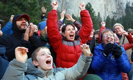 Gaelena Jorgenson, of Santa Rosa, center in red, raises her arms as her son Kevin completes a free climb of El Capitan