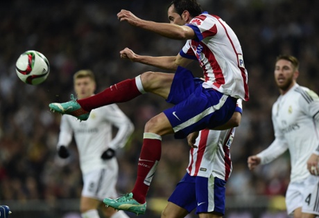 Atlético Madrid’s Diego Godin relieves the pressure.