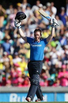 Eoin Morgan celebrates and acknowledges the crowd after scoring a century.