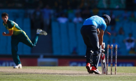Mitchell Starc sends Steven Finn's bails flying.