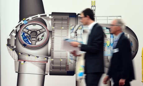 Visitors pass by the drawing of a powerhouse of a wind power station at the HUSUM 2012 Wind Energy Trade Fair on September 19, 2012 in Husum, Germany.