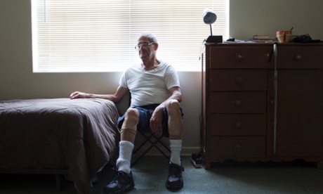 Paul sitting beside his bed
