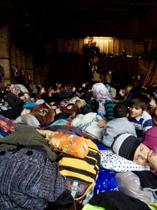 A handout picture taken on December 25, 2014 by Syrian migrants with mobile phones and released on January 5, 2015 shows migrants aboard the Moldovan-flagged ship Blue Sky M before their arrival in Gallipoli, southeastern Italy. Some 700 illegal migrants rescued from the ship near the Greek island of Corfu arrived in Italy on December 31 after their boat was intercepted while drifting towards the coast.