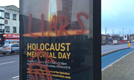 Police investigate after a Holocaust memorial day poster is defaced in Stratford, east London