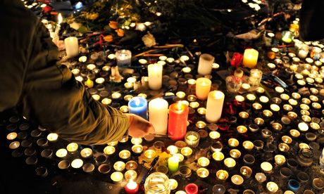 Candles at the Place de la République in Paris on 8 January, the day after the attack on the satiric